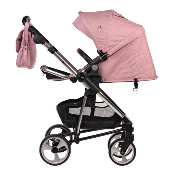 Amy Childs Roma Vita Pink Travel System The Roma Vita travel system includes everything you need for your baby. The package includes the Vita stroller, carrycot, car seat, changing bag, footmuff and raincover. The Vita chassis features lockable swivel front wheels and a compact, self-standing fold. An ergonomically shaped handle complements the leatherette bumper bar.