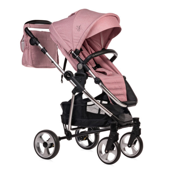 Amy Childs Roma Vita Pink Travel System The Roma Vita travel system includes everything you need for your baby. The package includes the Vita stroller, carrycot, car seat, changing bag, footmuff and raincover. The Vita chassis features lockable swivel front wheels and a compact, self-standing fold. An ergonomically shaped handle complements the leatherette bumper bar.