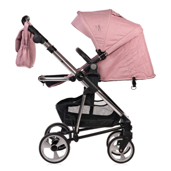 Amy Childs Roma Vita Pink Travel System The Roma Vita travel system includes everything you need for your baby. The package includes the Vita stroller, carrycot, car seat, changing bag, footmuff and raincover. The Vita chassis features lockable swivel front wheels and a compact, self-standing fold. An ergonomically shaped handle complements the leatherette bumper bar.