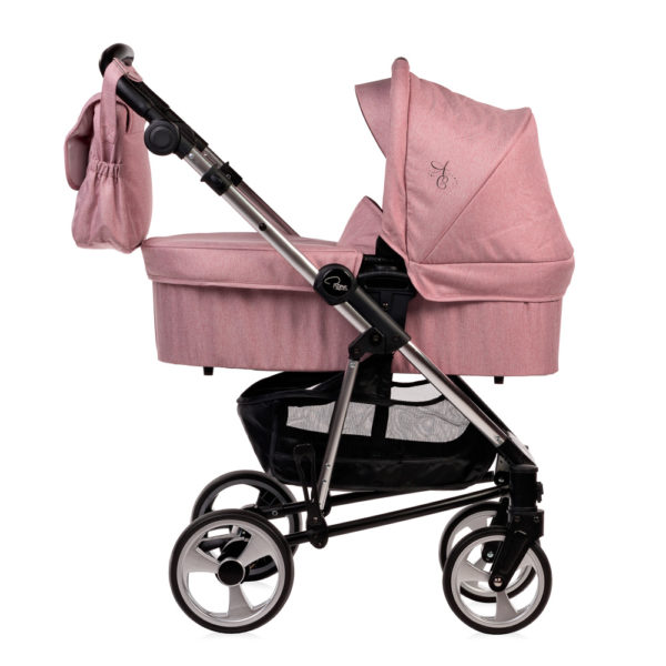 Amy Childs Roma Vita Pink Travel System The Roma Vita travel system includes everything you need for your baby. The package includes the Vita stroller, carrycot, car seat, changing bag, footmuff and raincover. The Vita chassis features lockable swivel front wheels and a compact, self-standing fold. An ergonomically shaped handle complements the leatherette bumper bar.