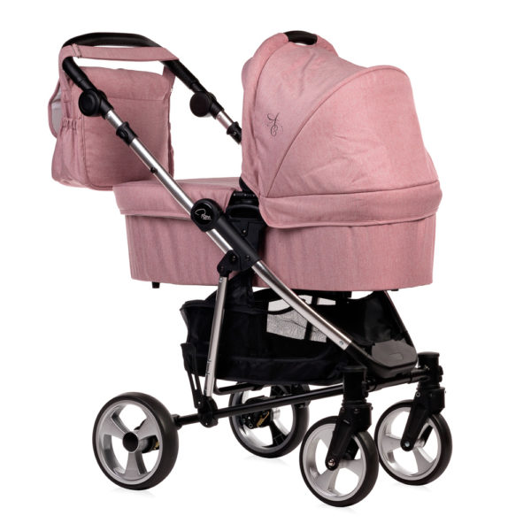 Amy Childs Roma Vita Pink Travel System The Roma Vita travel system includes everything you need for your baby. The package includes the Vita stroller, carrycot, car seat, changing bag, footmuff and raincover. The Vita chassis features lockable swivel front wheels and a compact, self-standing fold. An ergonomically shaped handle complements the leatherette bumper bar.