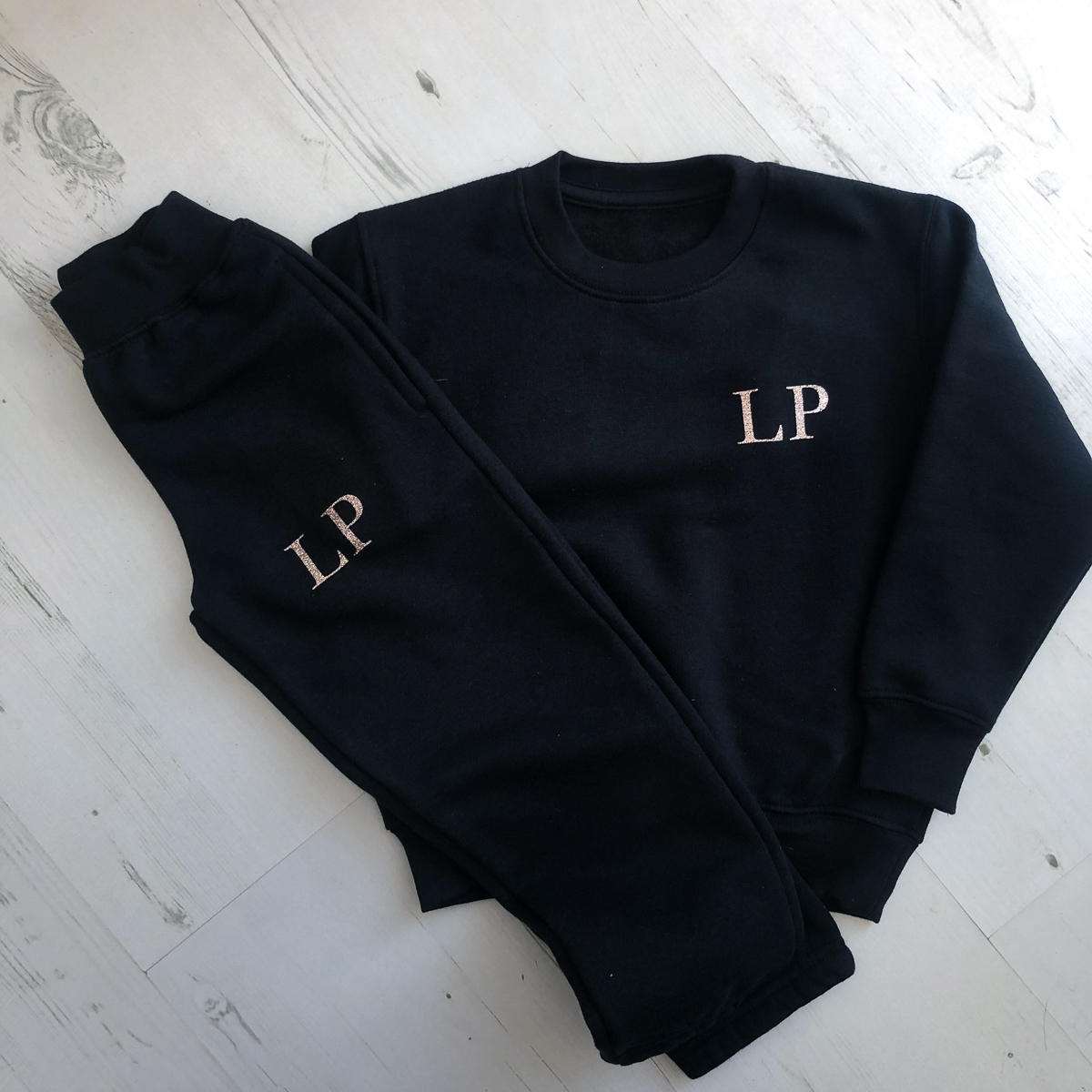 Black and rose gold tracksuit top