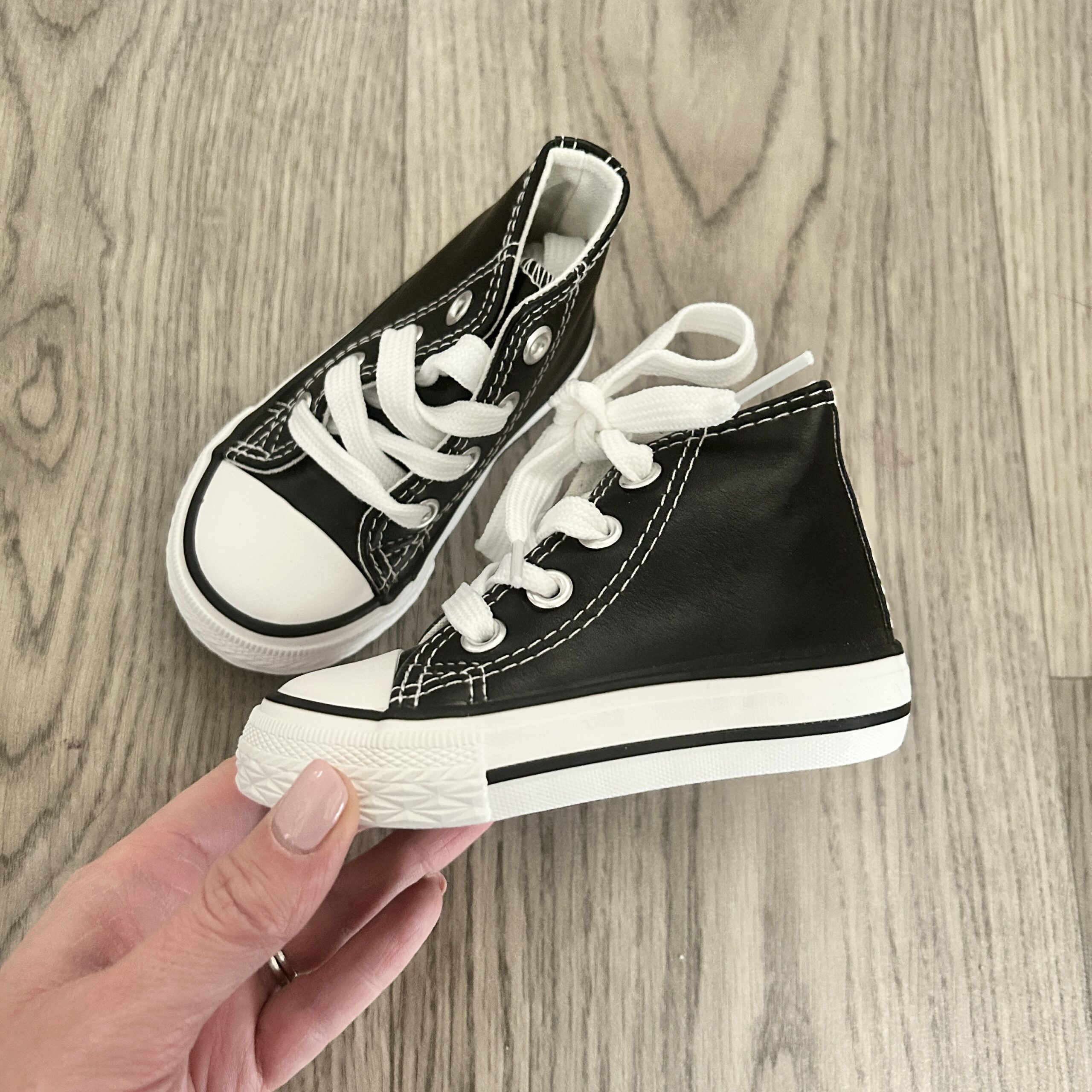 Black leather cheap look trainers