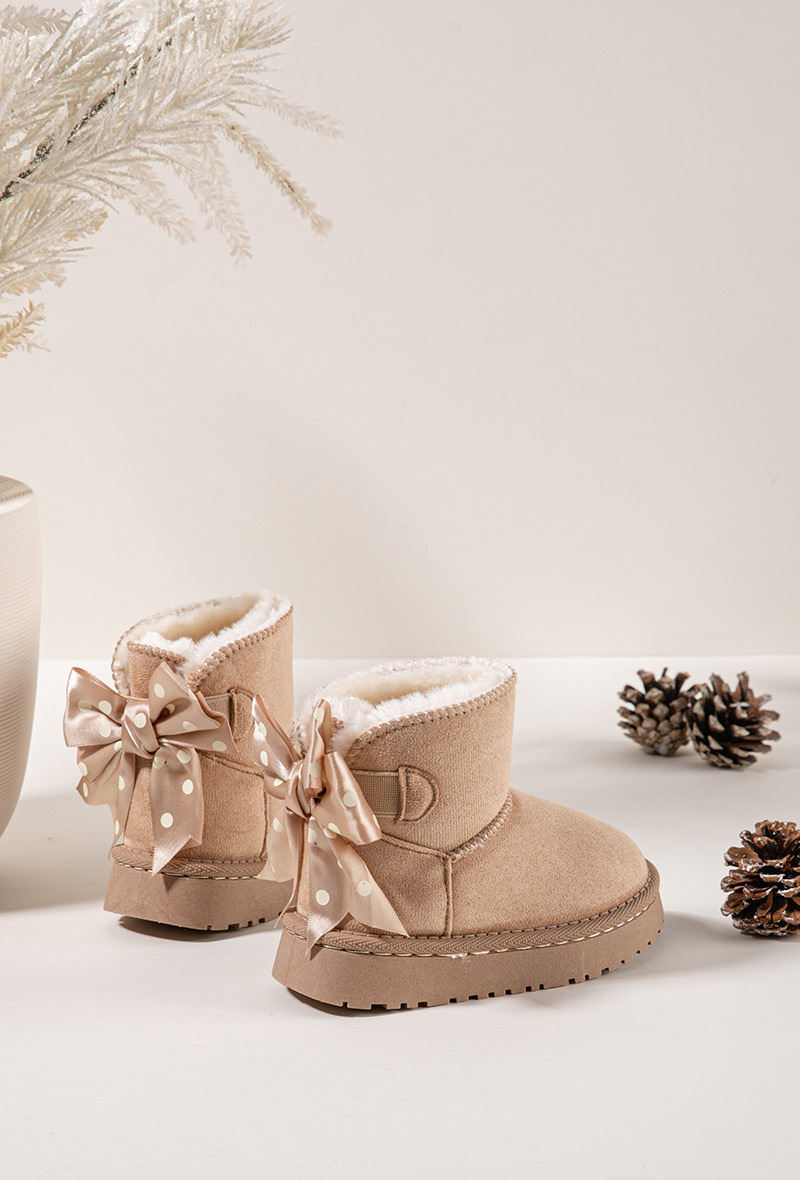 Back view of beige kids snuggle boots with oversized polka dot satin bows Back view of beige kids snuggle boots with oversized polka dot satin bows